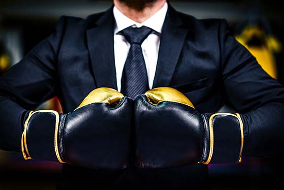 business man with boxing gloves for legal advertising competition post